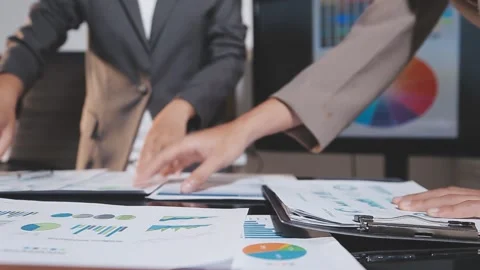 Business partnership coworkers using a tablet to analysis graph company fin.. Stock Footage 342229341