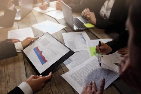 Business people analyzing documents Stock Photos