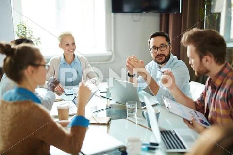 Business people analyzing financial increase at meeting Stock Photos