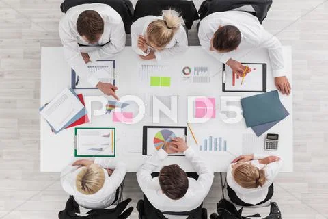 Business people and graphs Stock Photos