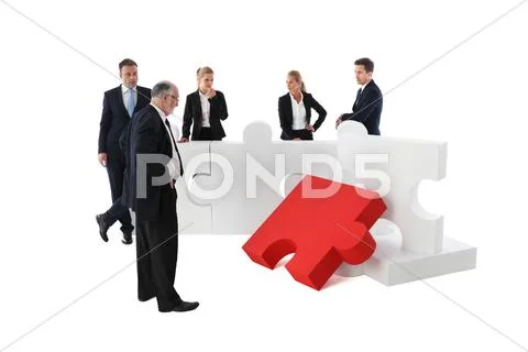 Business people and puzzle Stock Photos