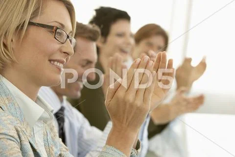 Business People Applauding At Conference Table Stock Photos
