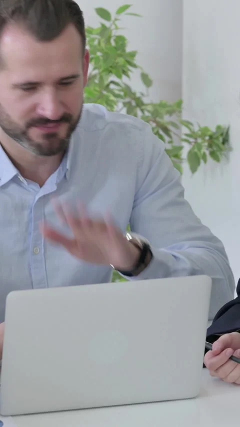 Business People Arguing while using Laptop in Office, Vertical Video Stock Footage 340036075