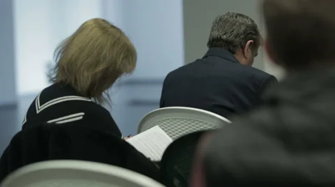 Business people attending a seminar Stock Footage 60146853