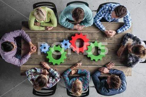 Business people with cogs of business Stock Photos