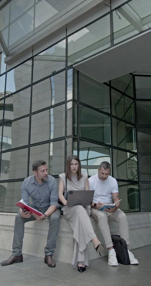 Business People Collaborating Outdoors, Utilizing Modern Technology for Work and Stock Footage 315807913