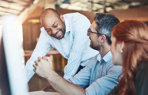 Business people, computer and help with teamwork, mentor and funny with joke Stock Photos