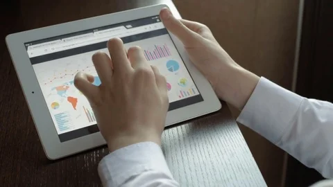 Business people developing a business project and analyzing market data Stock Footage 71386439