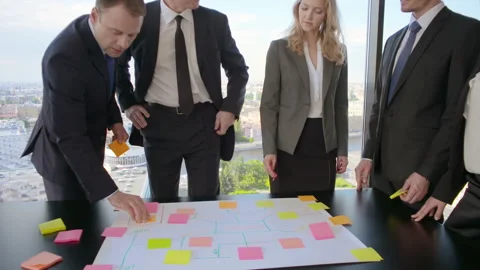 Business people developing plan on office desk Video stock 91937144