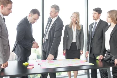 Business people developing plan on office desk Stock Photos