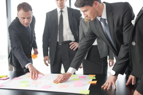 Business people developing plan on office desk Stock Photos