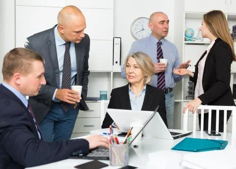 Business people developing strategy in modern office Stock Photos