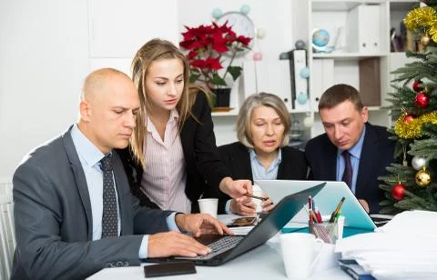 Business people developing strategy for teamwork in modern office with laptop Stock Photos