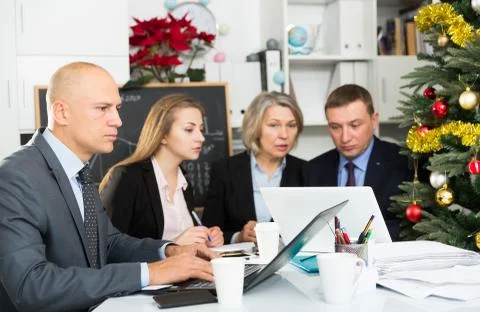 Business people developing strategy for teamwork in modern office with laptop Stock Photos
