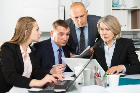 Business people developing strategy for teamwork in modern office Stock Photos
