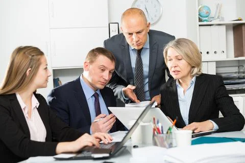 Business people developing strategy for teamwork in modern office Stock Photos