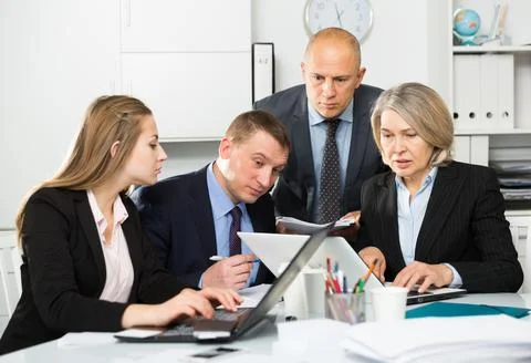 Business people developing strategy for teamwork in modern office Stock Photos