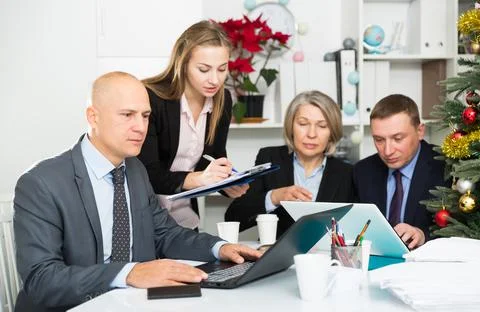 Business people developing strategy for teamwork in modern office with laptop Stock Photos