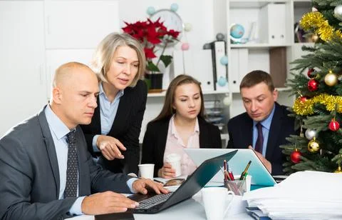 Business people developing strategy for teamwork in modern office with laptop Stock Photos
