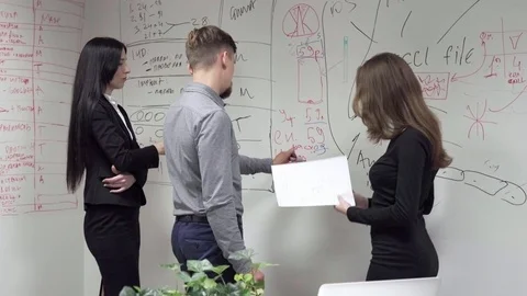 Business people discussing something while brainstorming in office Stock Footage 80561415