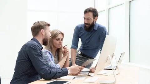 Business people discussing work documents in the office . Stock Footage 157385300