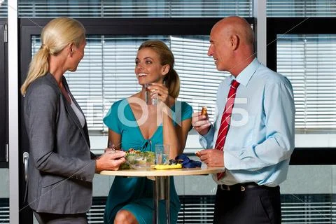 Business People Eating Lunch In Office