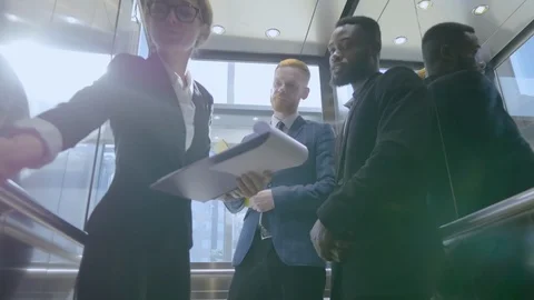 Business people in elevator Stock Footage 121145452