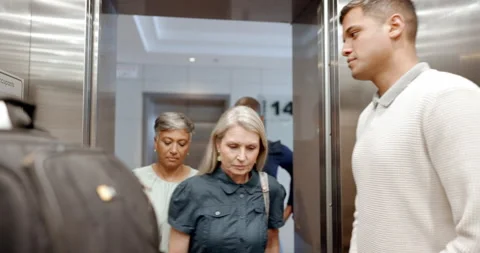 Business people, enter elevator and talking for work, diversity or walking to Stock Footage 226320456