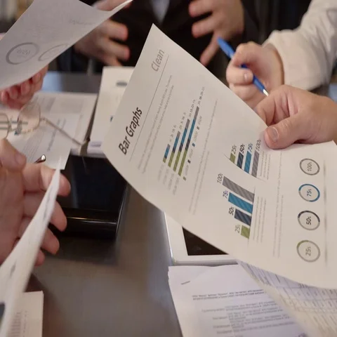 Business people exchanging documents, closeup shot Stock Footage 69121659
