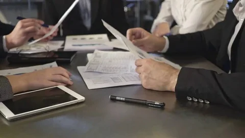 Business people exchanging documents, closeup shot Stock Footage 69122443
