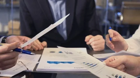 Business people exchanging documents, closeup shot Stock Footage 69708728