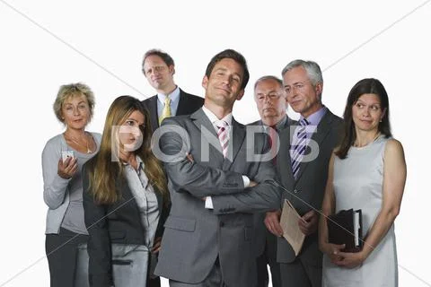 Business people with file, diary, mobile phone and newspaper against white Stock Photos