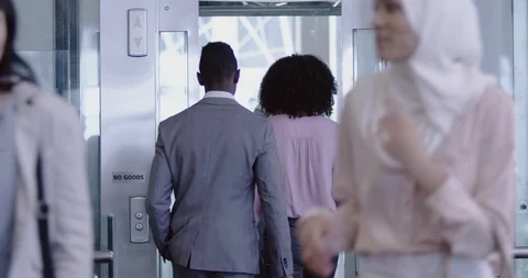 Business people getting in the elevator at modern office 4k Video stock 112020687