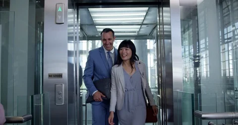 Business people getting out of elevator in a modern office 4k Stock-Footage 112019840