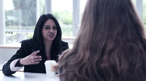 Business people having a discussion in cafeteria Stock Footage 59382496