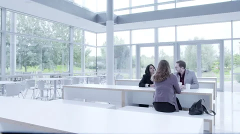 Business people having a discussion in cafeteria Stock Footage 59383210