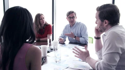 Business people having a discussion in conference room Stock Footage