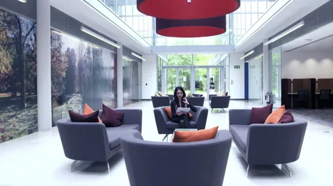 Business people having a discussion in office lobby Stock Footage 59383639