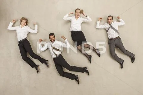 Business people jumping in office Stock Photos