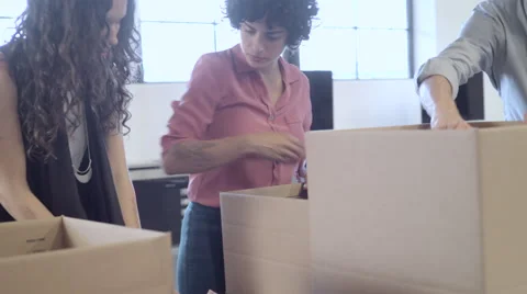 Business People Packing Boxes In Office Clip