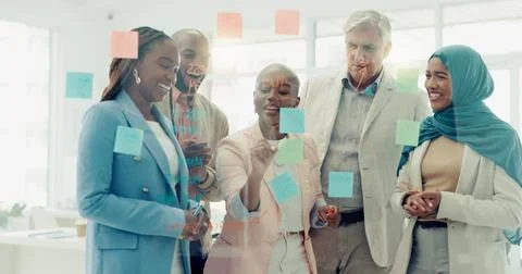 Business people, planning with glass board and collaboration with postit notes Stock Photos