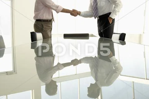 Business People Shaking Hands In Conference Room Stock Photos