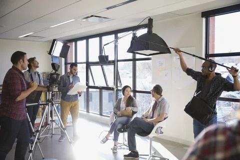 Business people shooting video tutorial Stock Photos