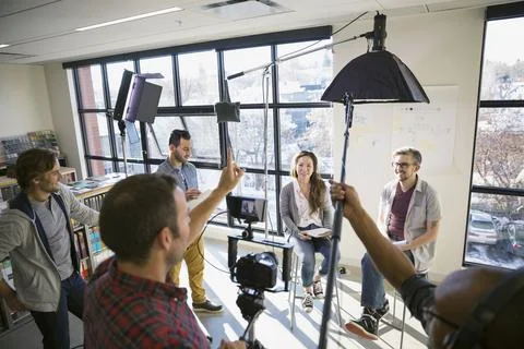 Business people shooting video tutorial Stock Photos