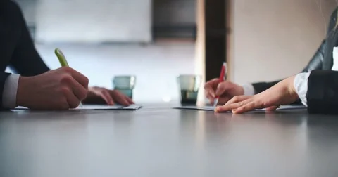 Business People Signing Contracts Together Concluding Deal By Firm Handshake Stock Footage