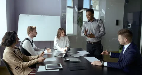 Business people sitting in office listening to expert tutor investor leader Stock Footage 142394654