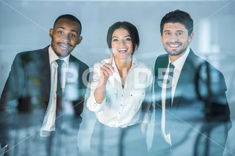 The business people stand near the window Stock Photos