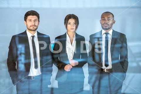 The business people stand near the window Stock Photos