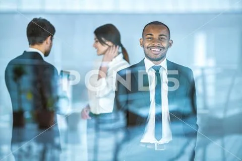 The business people stand near the window Stock Photos