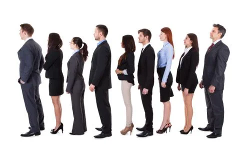 Business people standing in queue Stock Photos